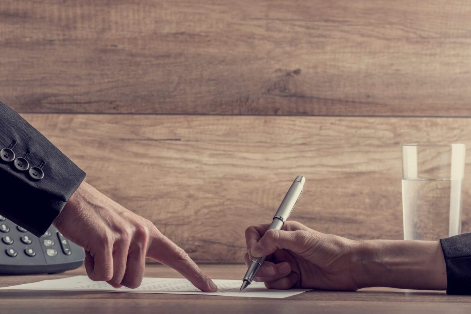 person pointing at a document showing  the penalty for a late enrollment for a person turning 65